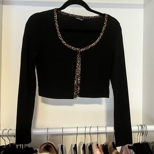 black cropped long sleeve with leopard print edges